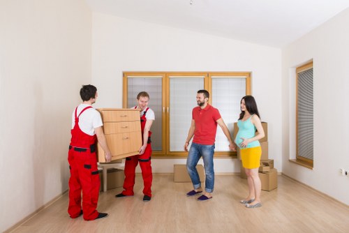 Moving team transporting items for a Docklands flat relocation