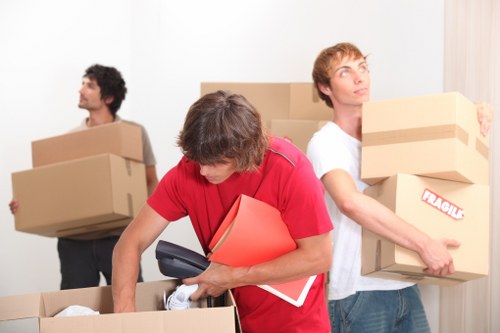 Docklands removals team planning a residential move near modern apartment buildings