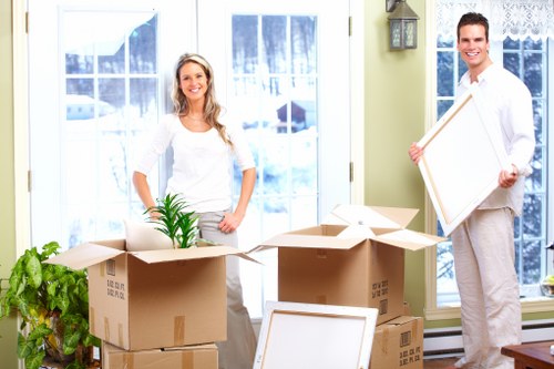 Local furniture pick-up service loading items for transport in Docklands